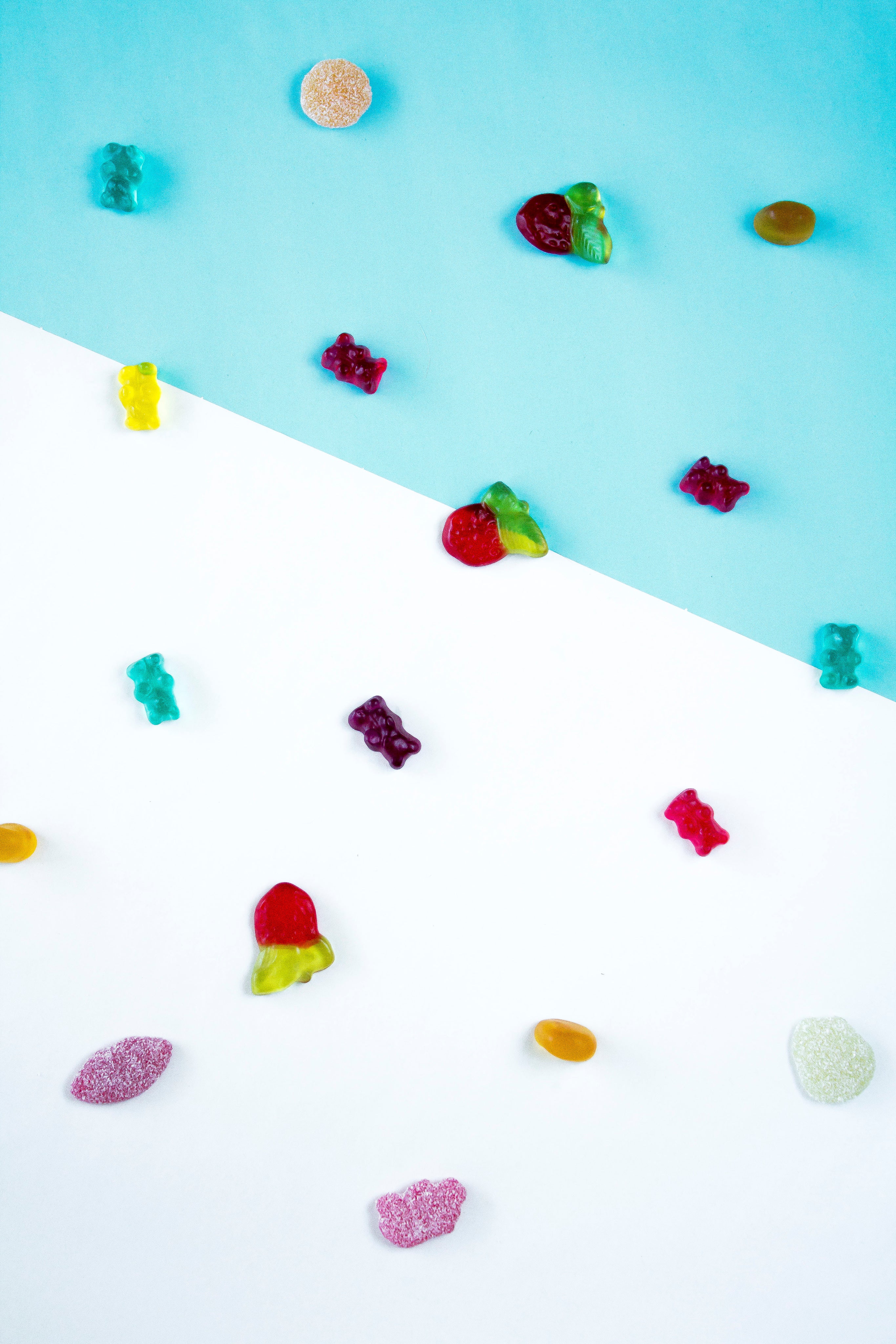 Gummies on a white and blue floor